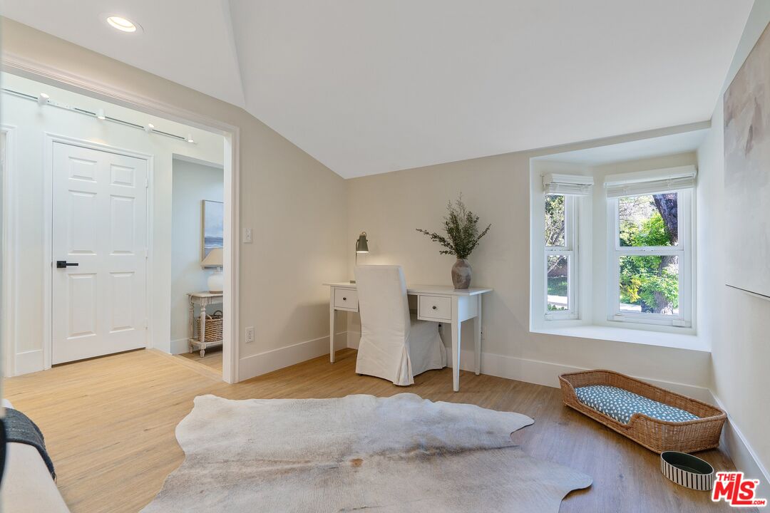 22801 Pera Road Woodland Hills, CA 91364 - Photo 21 of 46 a bedroom with a bed and a window