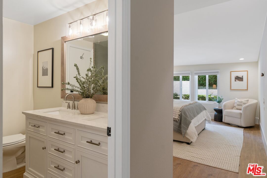 22801 Pera Road Woodland Hills, CA 91364 - Photo 23 of 46 a living room with furniture and a mirror