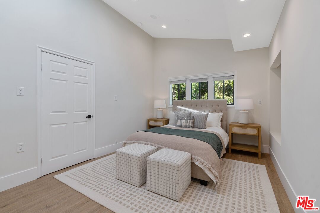 22801 Pera Road Woodland Hills, CA 91364 - Photo 25 of 46 a bedroom with a bed and a window
