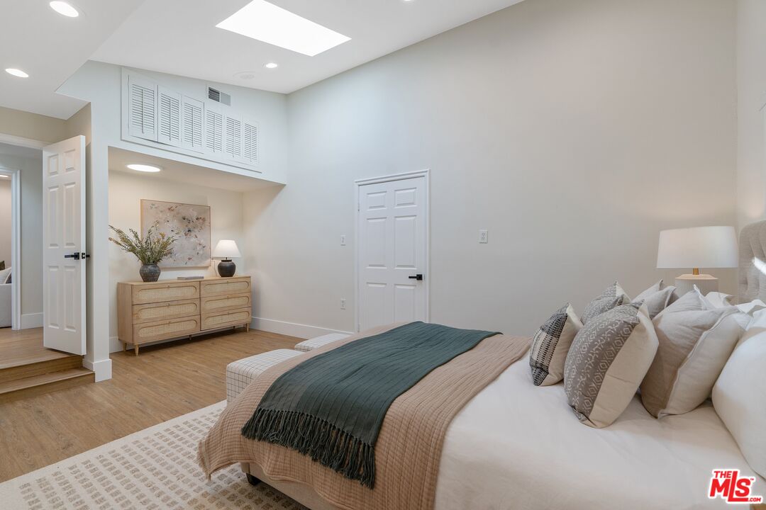 22801 Pera Road Woodland Hills, CA 91364 - Photo 26 of 46 a bedroom with a bed and window