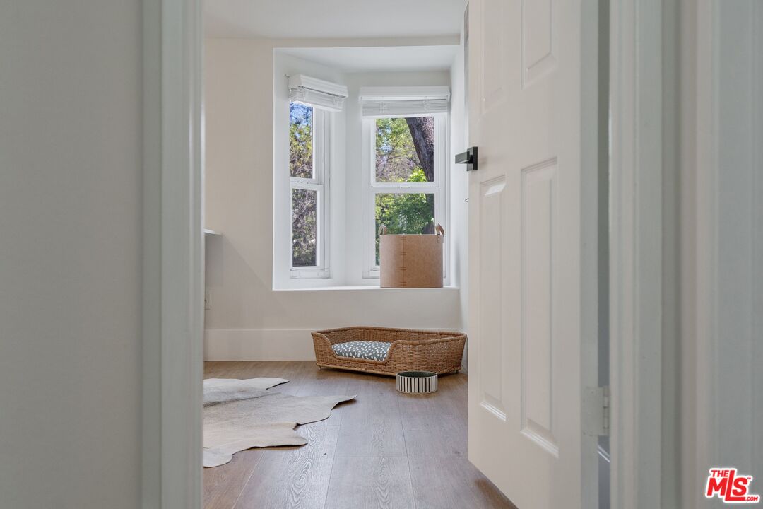 22801 Pera Road Woodland Hills, CA 91364 - Photo 33 of 46 a living room with furniture and a window