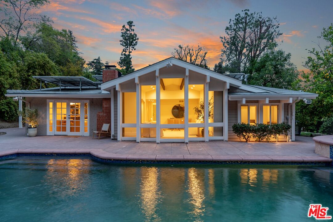 22801 Pera Road Woodland Hills, CA 91364 - Photo 39 of 46 a view of a house with swimming pool and sitting area