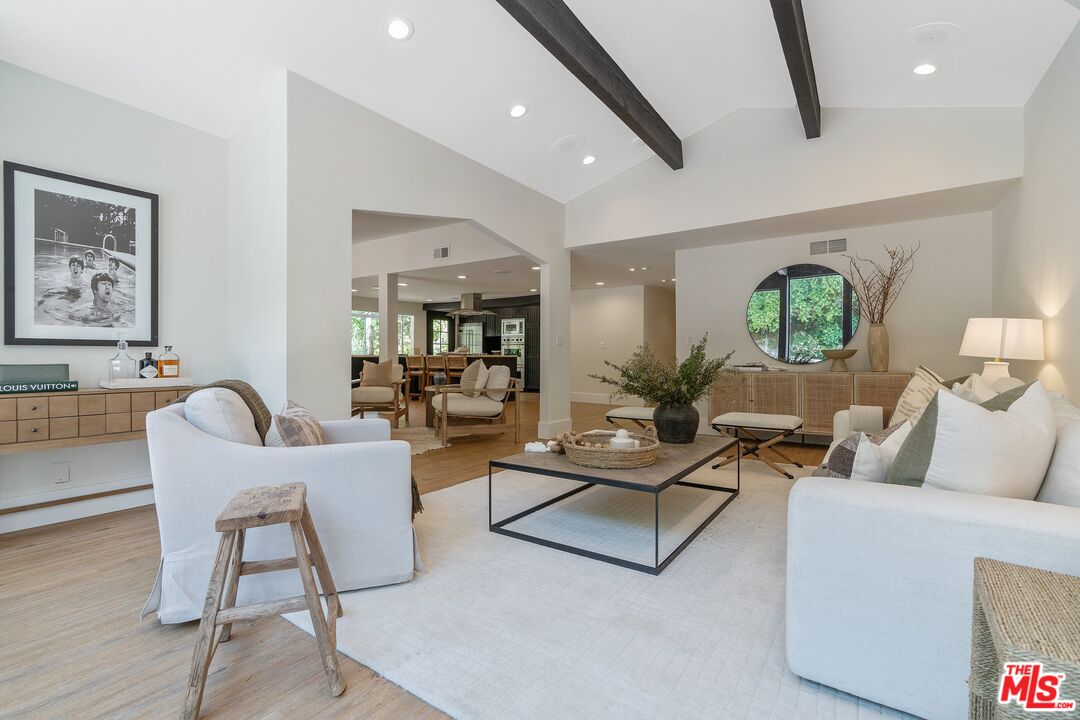 22801 Pera Road Woodland Hills, CA 91364 - Photo 7 of 46 a living room with furniture and wooden floor
