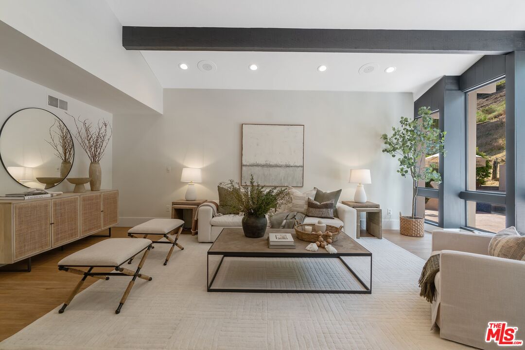 22801 Pera Road Woodland Hills, CA 91364 - Photo 10 of 46 a living room with furniture