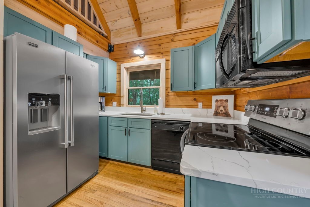 192 Dewitt Barnett Road Vilas, NC 28692 - Photo 13 of 32 a kitchen with stainless steel appliances granite countertop a refrigerator and a stove