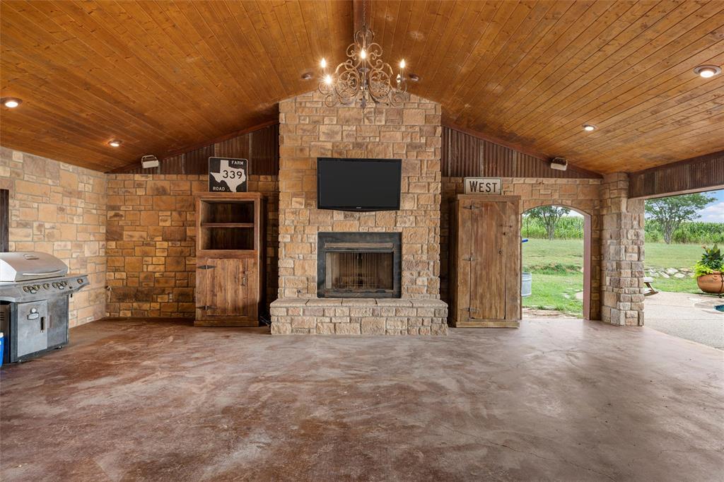 3057 Holy Road Abbott, TX 76621 - Photo 8 of 39 a view of an empty room with a fireplace and a window