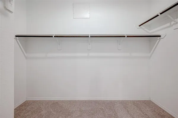 a view of an empty walk in closet