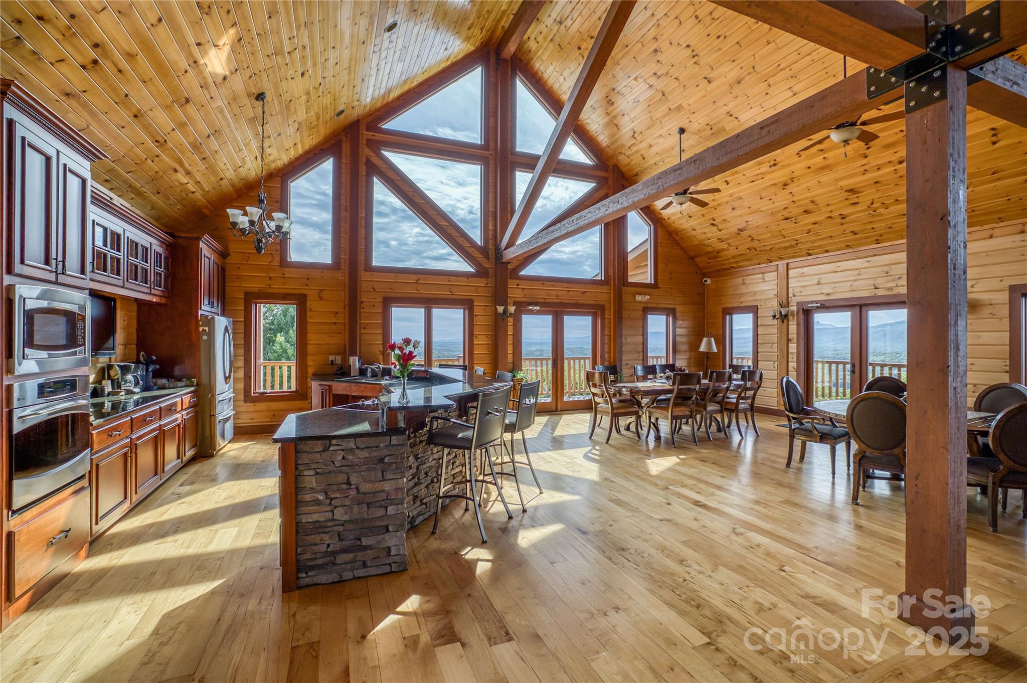 1030 River Club Ridge Lenoir, NC 28645 - Photo 21 of 34 a view of a dining hall with lots of tables and chairs