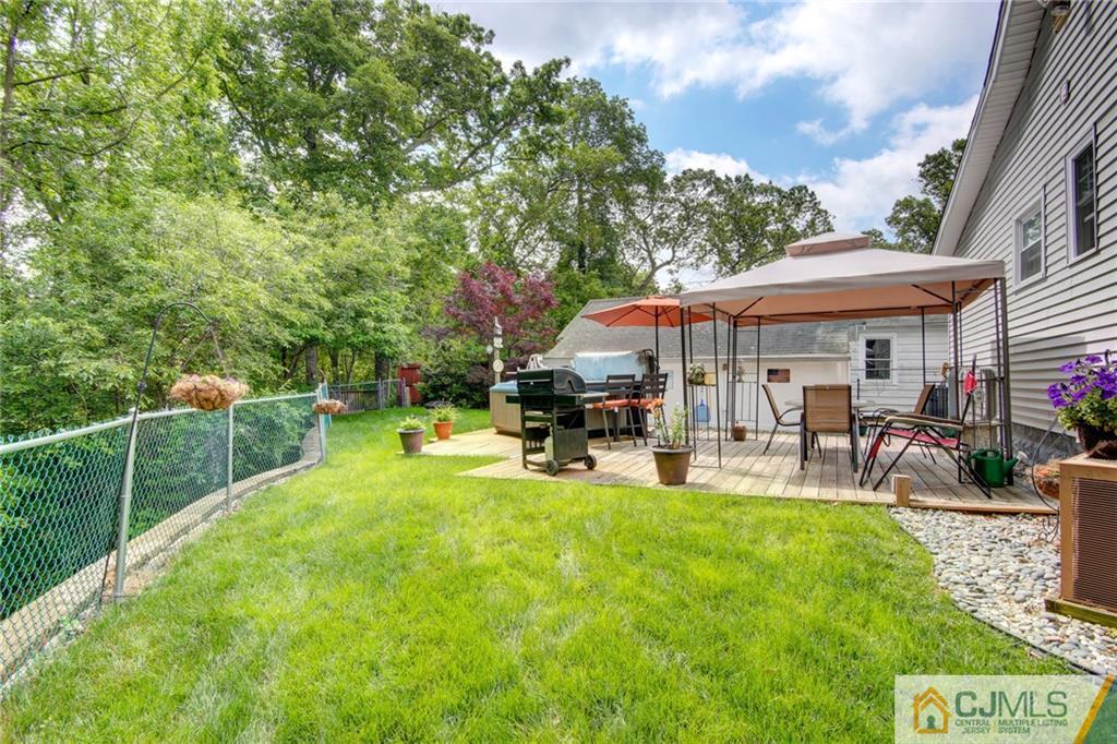 60 Brookside Road Spotswood, NJ 08884 - Photo 8 of 34 a view of a house with swimming pool and sitting area