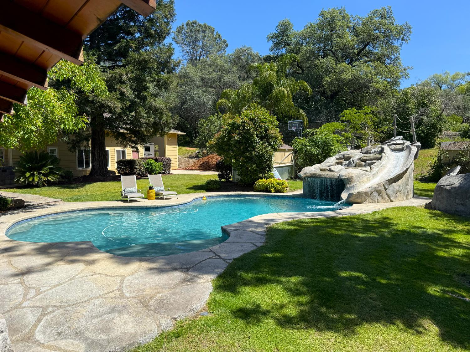 7396 Callison Road Penryn, CA 95663 - Photo 4 of 99 Resort-style pool with waterfall and slide, creating the ultimate backyard retreat