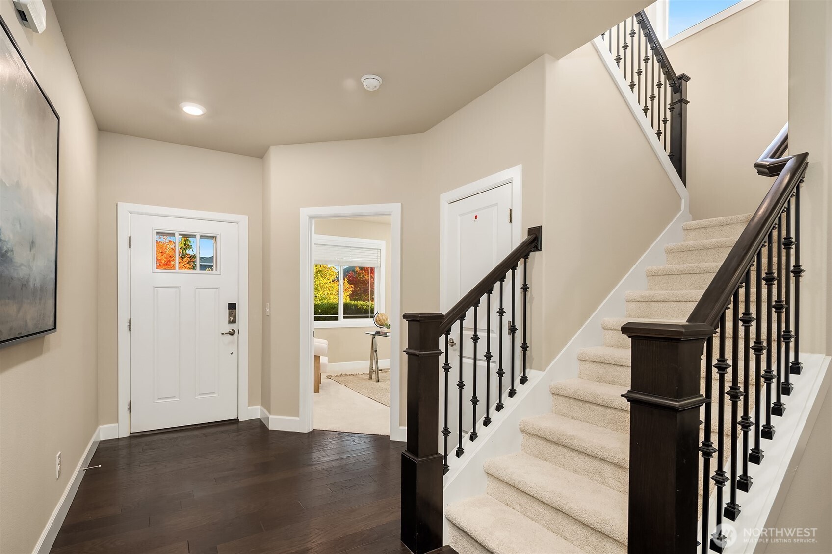 4111 174th Street Southeast Bothell, WA 98012 - Photo 18 of 40 a view of a hallway with wooden floor and staircase