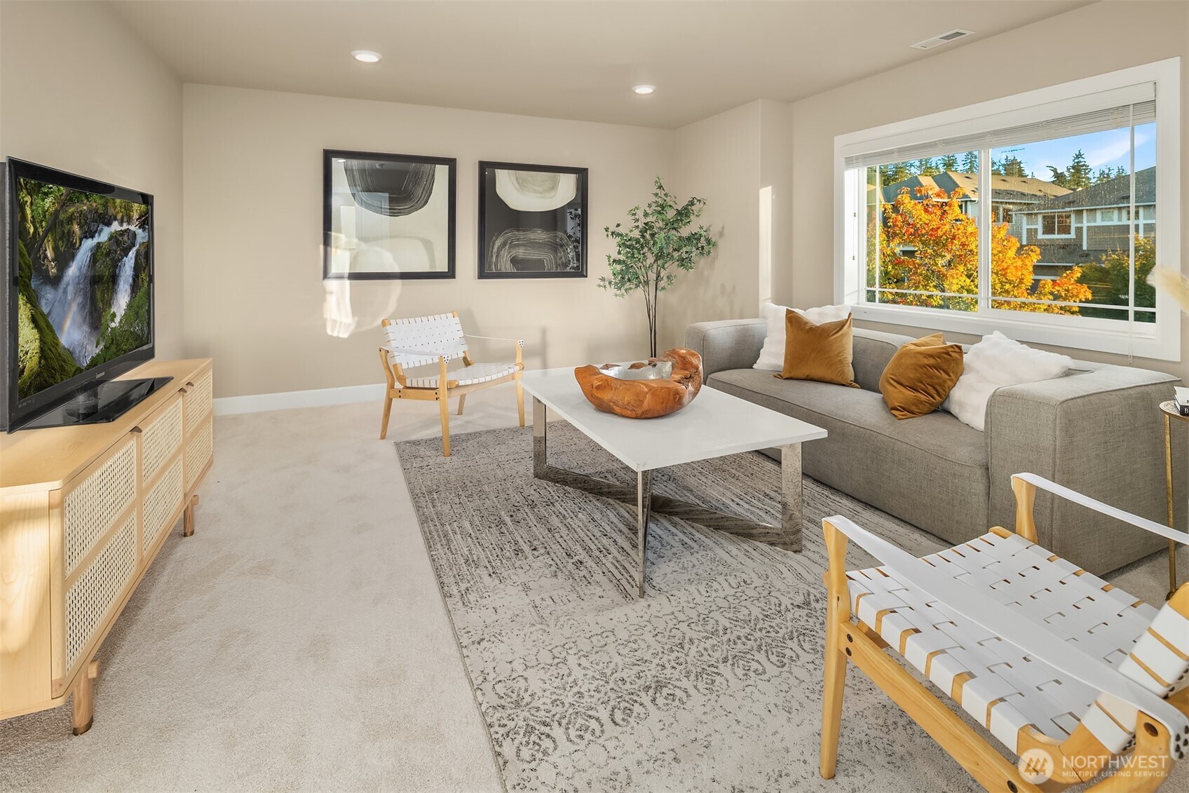 4111 174th Street Southeast Bothell, WA 98012 - Photo 21 of 40 a living room with furniture and a flat screen tv