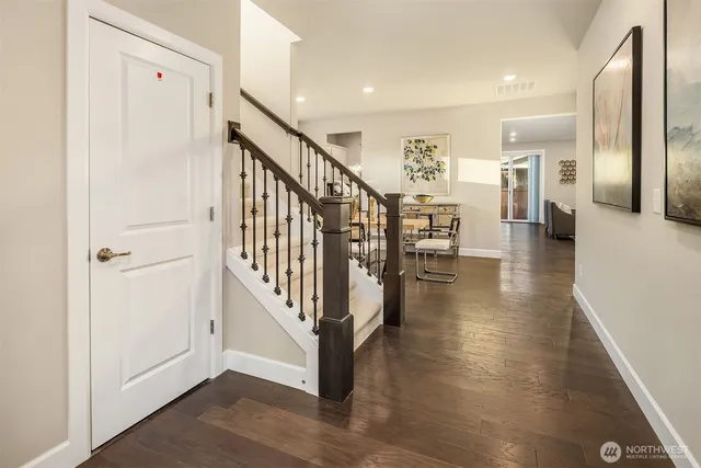 a view of a hallway with seating area