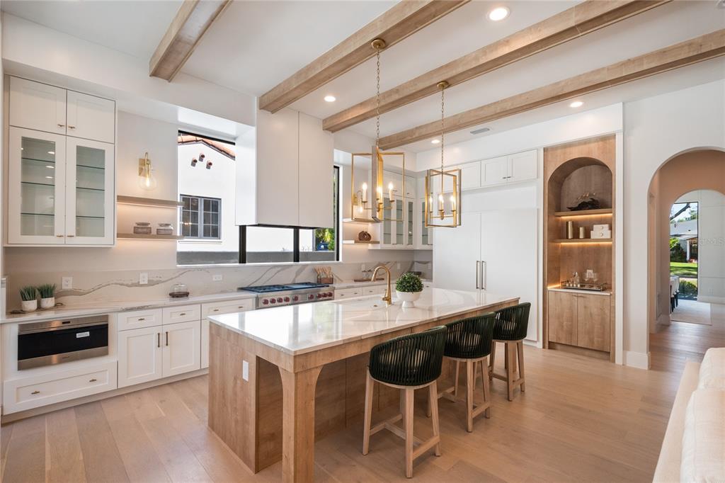 1751 Glencoe Road Winter Park, FL 32789 - Photo 11 of 45 a kitchen with a sink and chairs