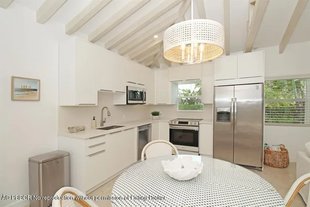 a bathroom with a sink a mirror and a shower