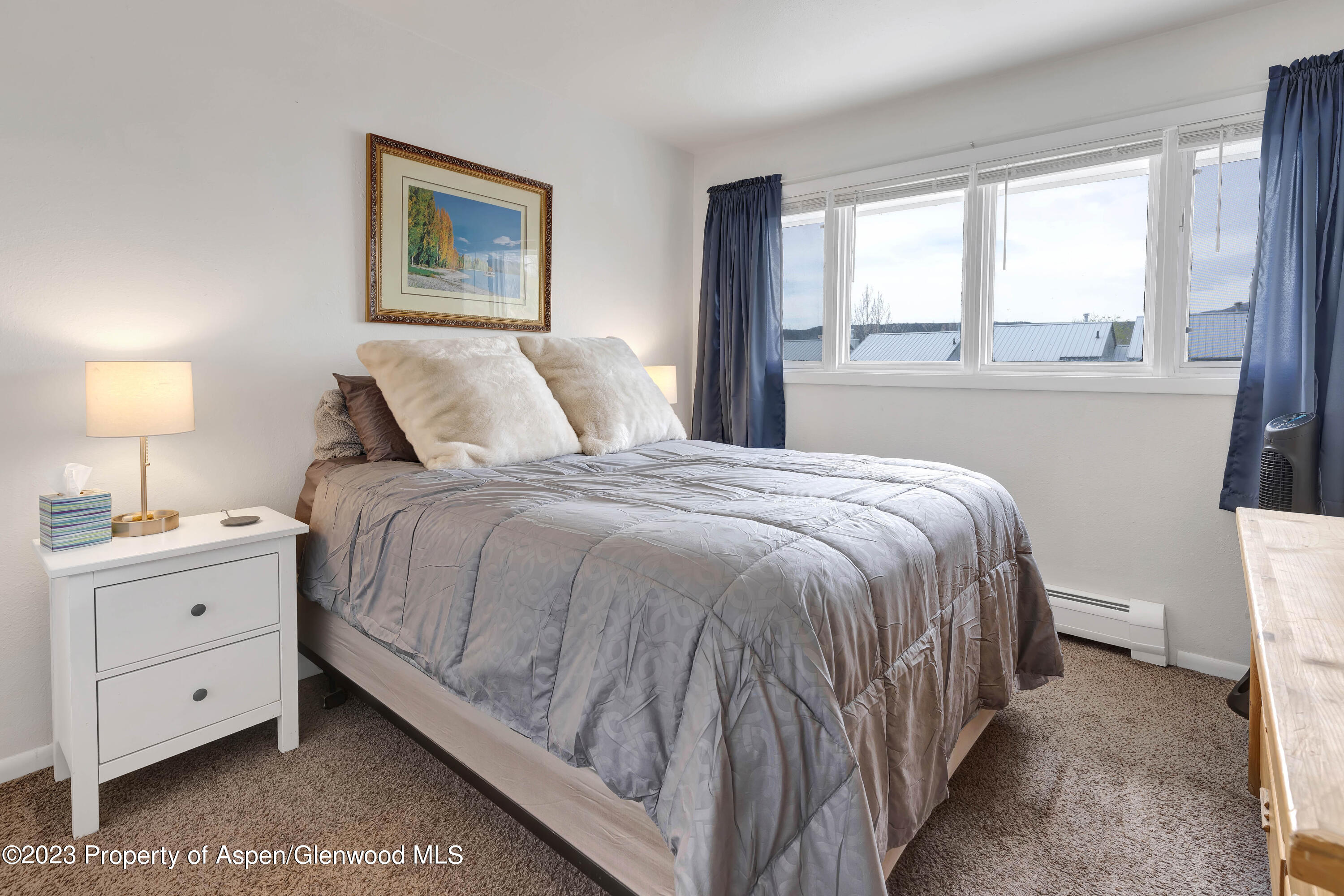 1173 Park Avenue Rifle, CO 81650 - Photo 13 of 26 a bedroom with a bed and a window