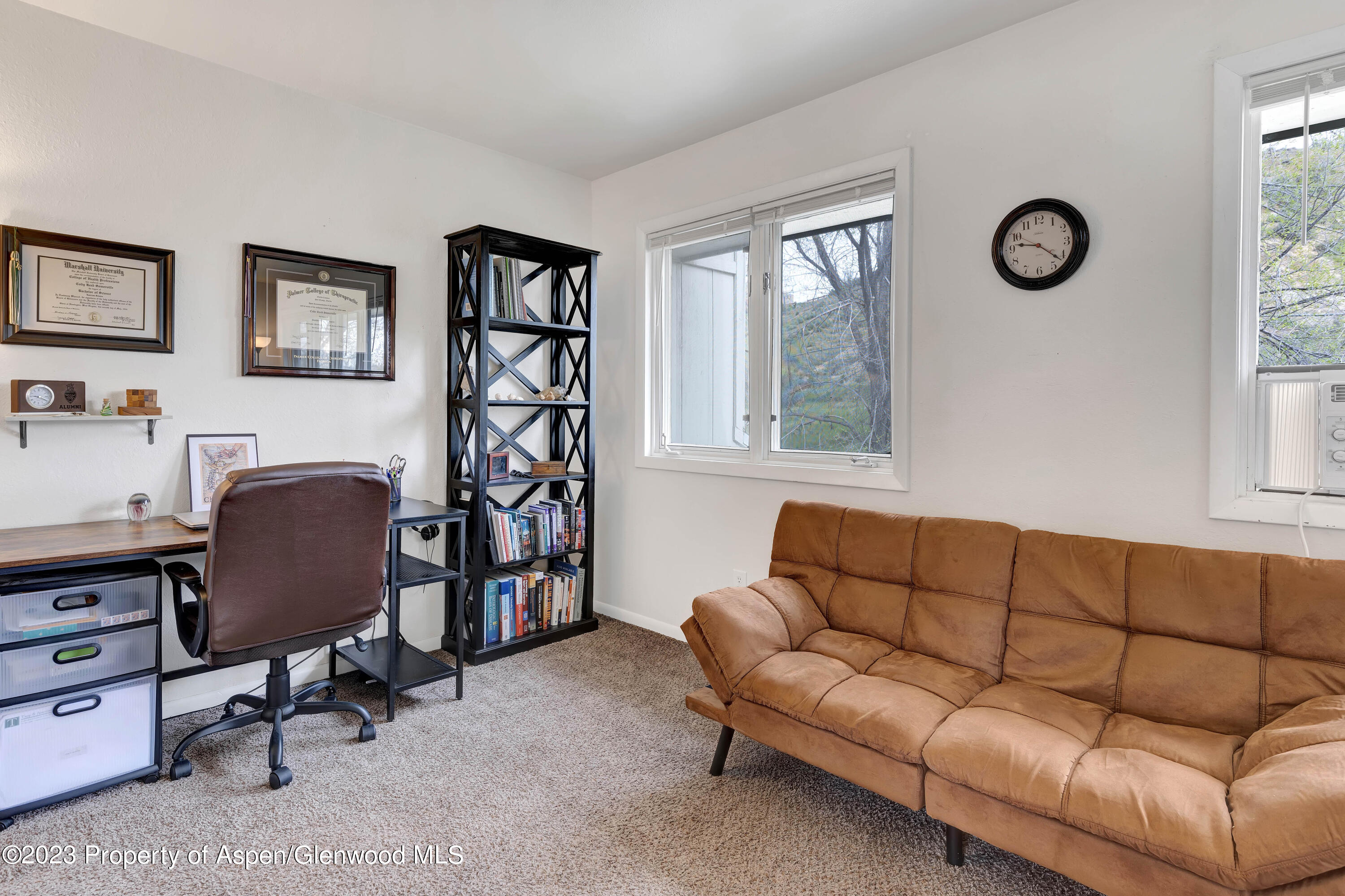 1173 Park Avenue Rifle, CO 81650 - Photo 14 of 26 a living room with furniture and a window