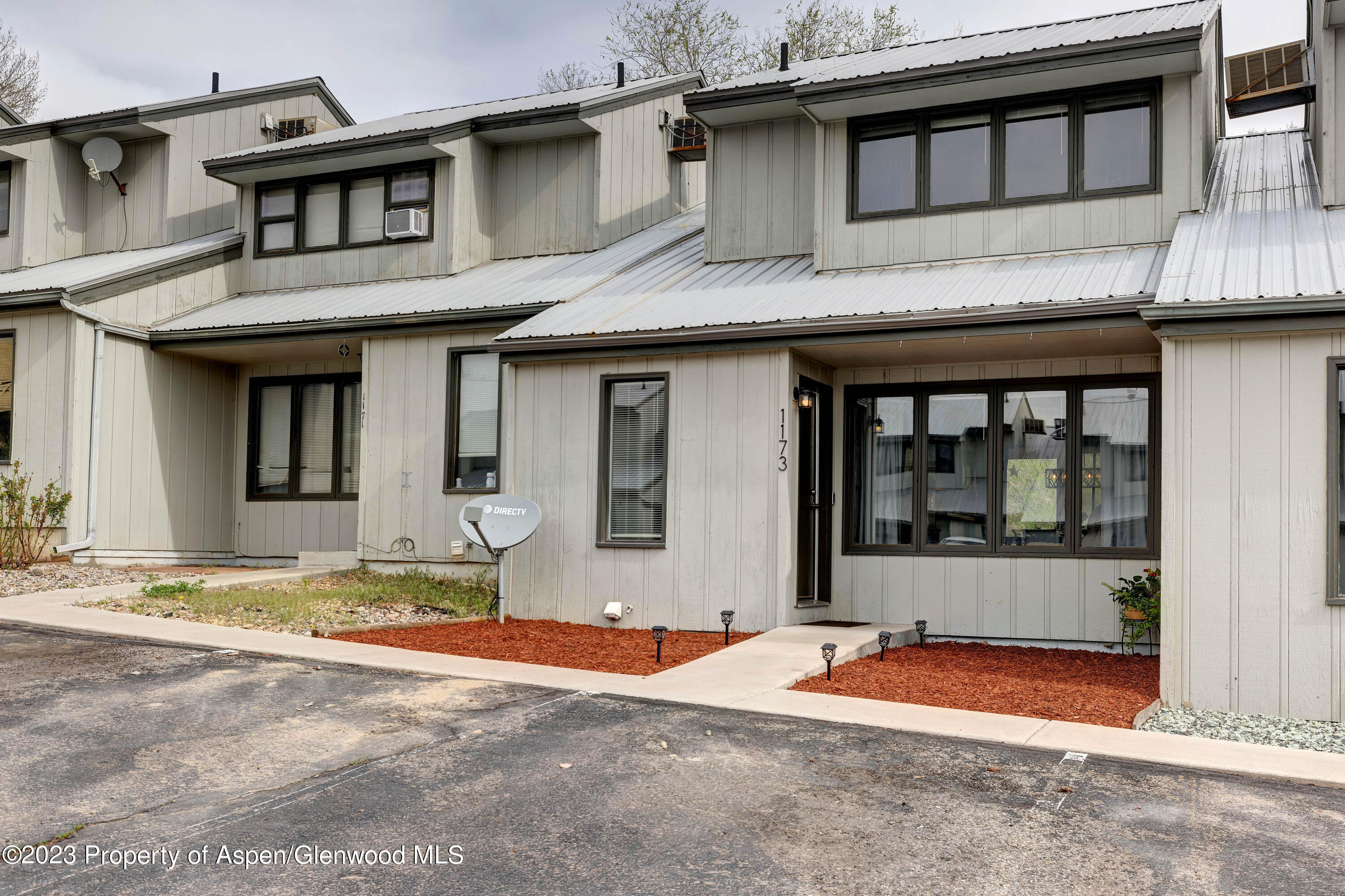 1173 Park Avenue Rifle, CO 81650 - Photo 23 of 26 a front view of a house with a basket ball court and wooden floor