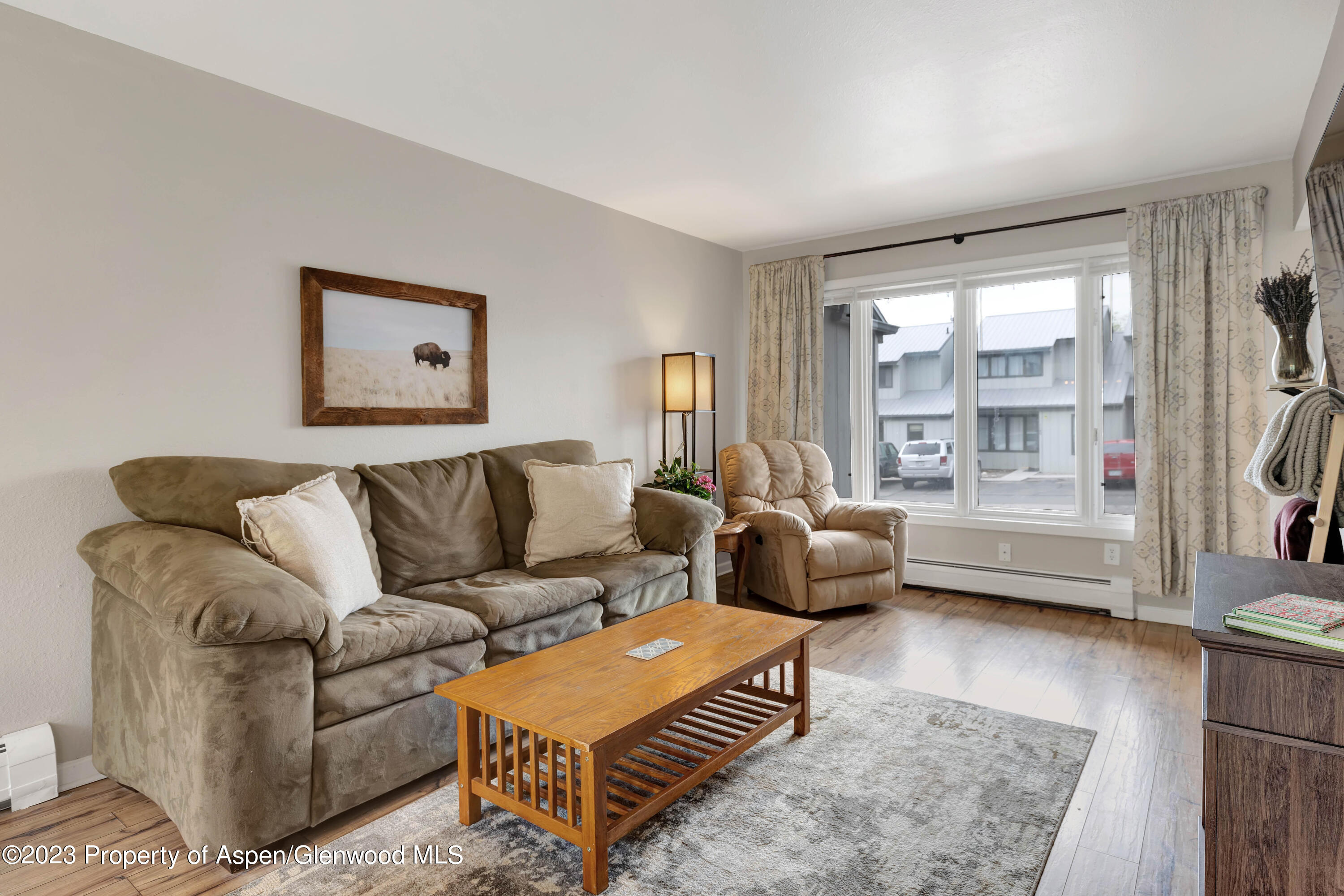 1173 Park Avenue Rifle, CO 81650 - Photo 6 of 26 a living room with furniture and a large window