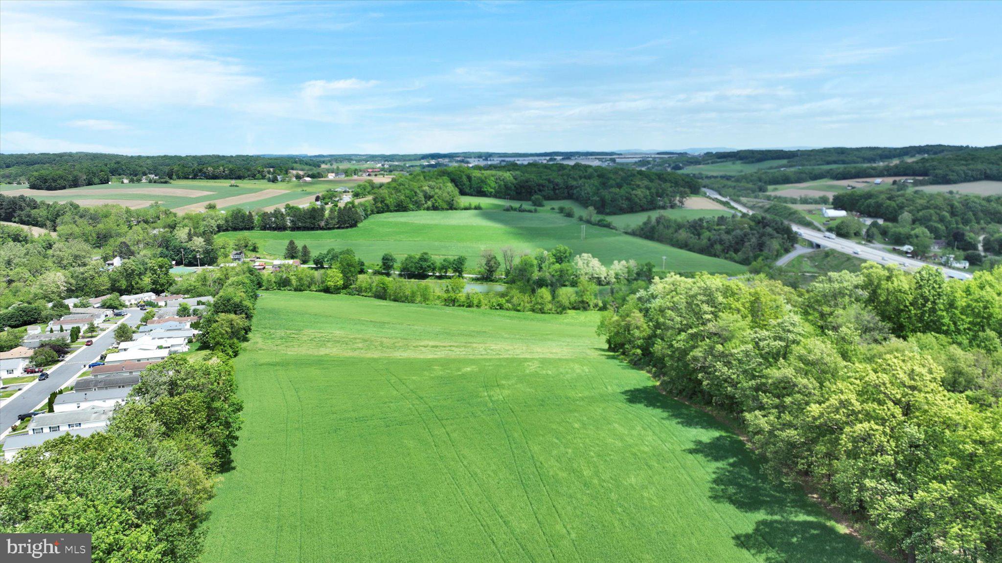 235 Stump Road Kutztown, PA 19530 - Photo 18 of 38 a view of a green field with lots of bushes