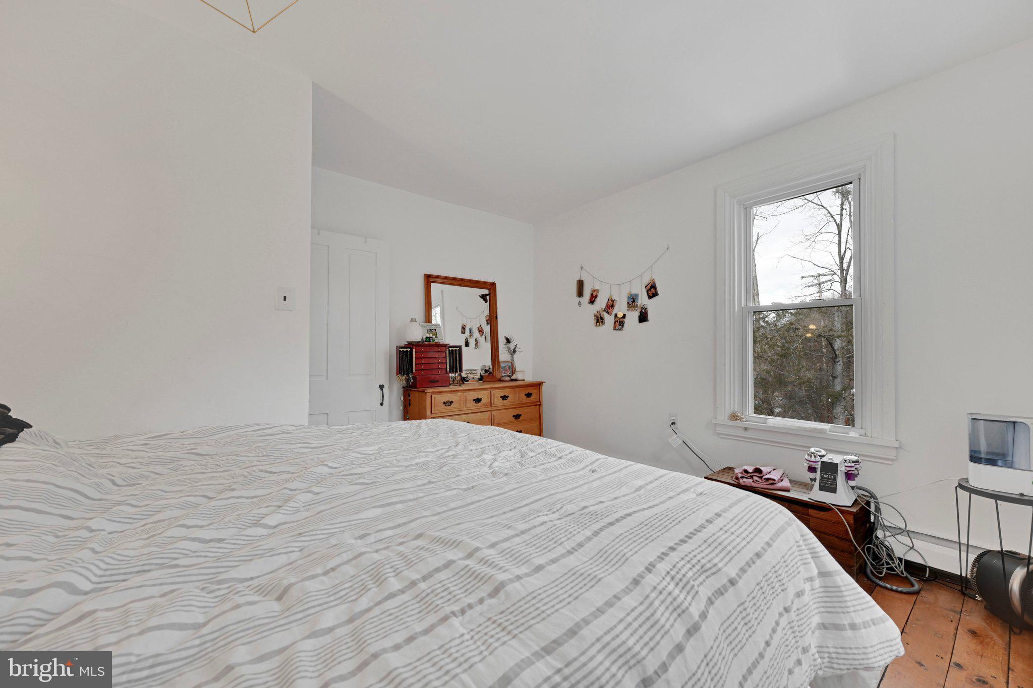 235 Stump Road Kutztown, PA 19530 - Photo 30 of 38 a bedroom with a bed and a window