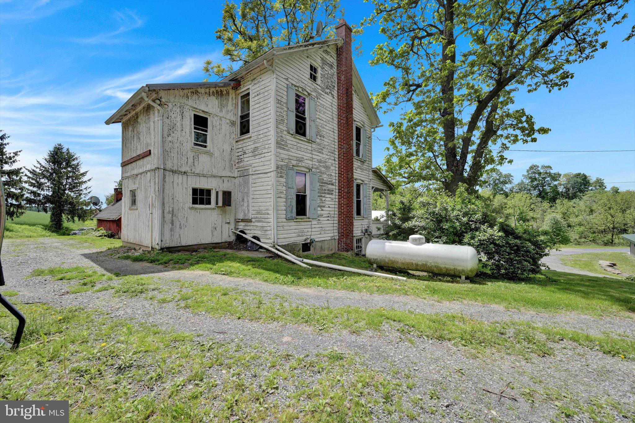 235 Stump Road Kutztown, PA 19530 - Photo 7 of 38 a white house that has a tree in front of it