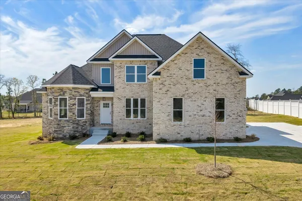 a front view of a house with swimming pool