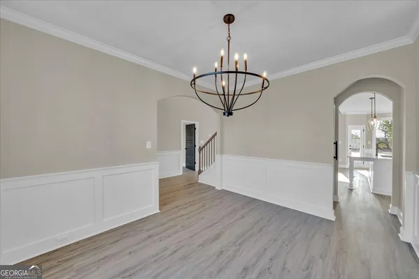 a view of kitchen with furniture and wooden floor
