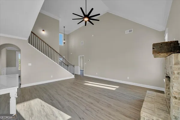 a kitchen with stainless steel appliances granite countertop a sink a refrigerator and a stove