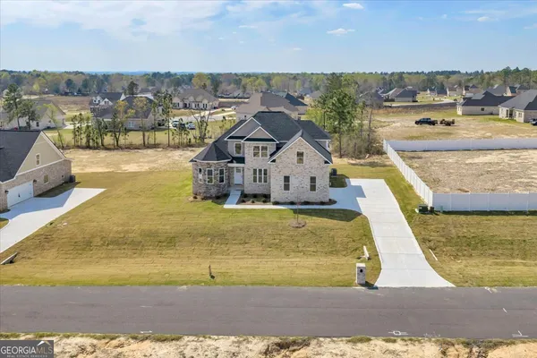 a front view of a house with a yard