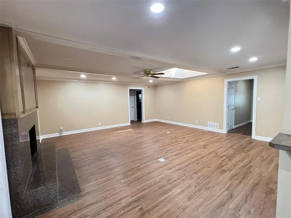 a view of a livingroom with wooden floor