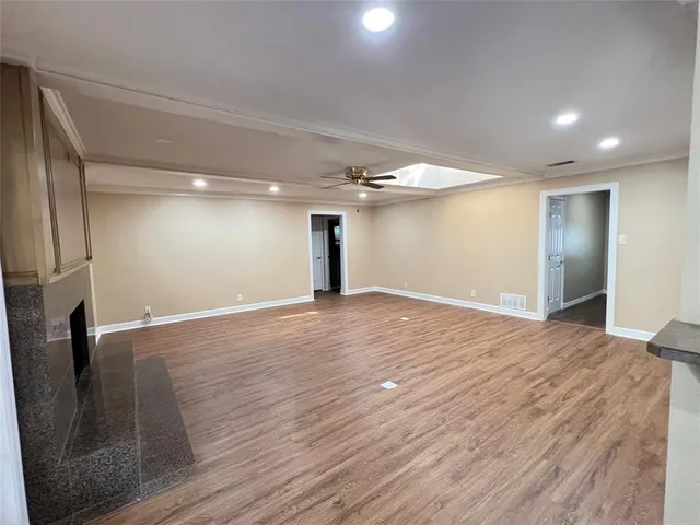 a view of a livingroom with wooden floor