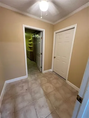 a kitchen with a refrigerator and cabinets