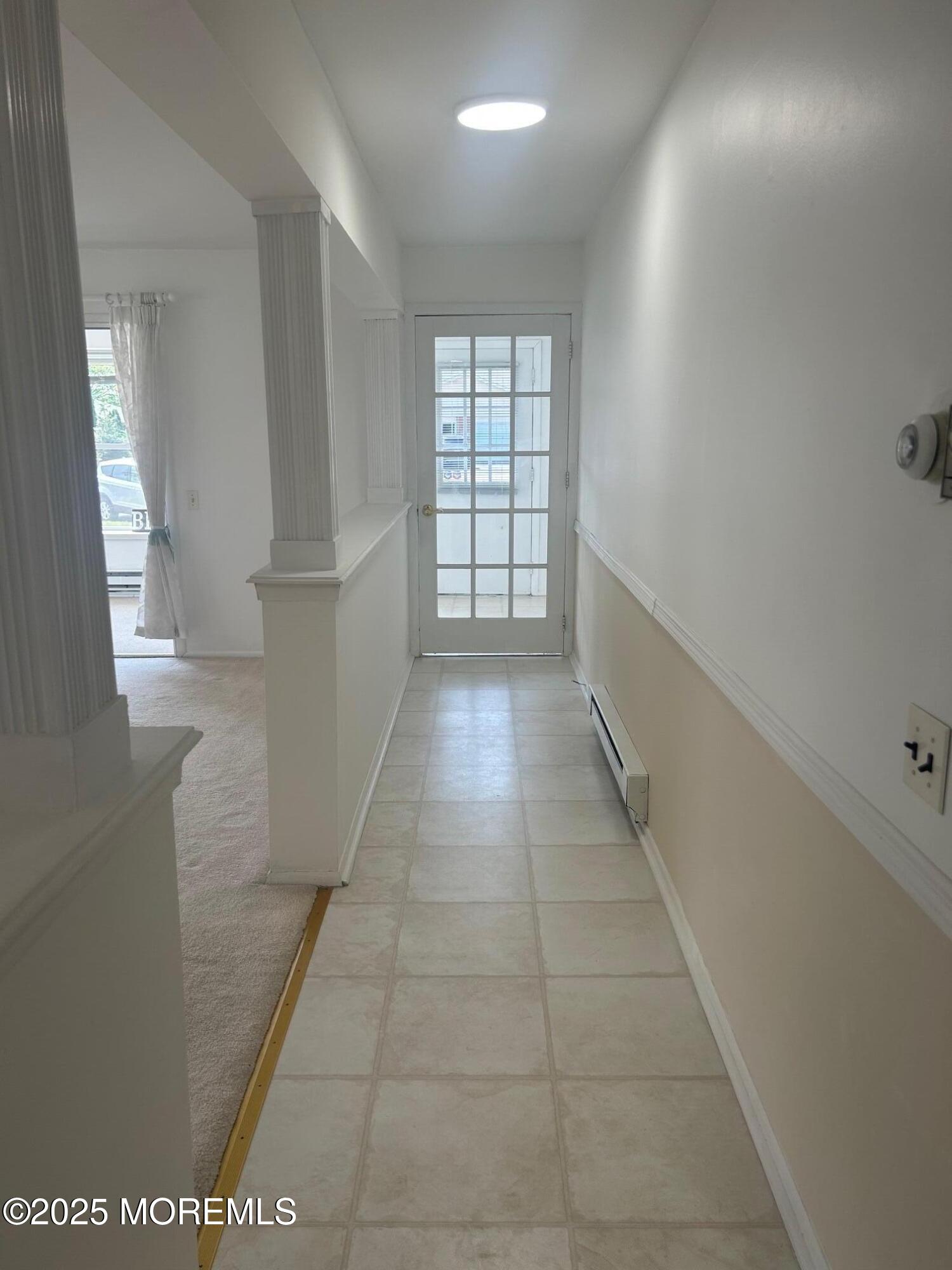 1 B Pilgrim Court Whiting, NJ 08759 - Photo 9 of 24 a view of hallway with window and stairs