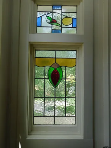 a white toilet sitting next to a bathroom sink