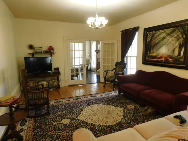 a living room with furniture and a flat screen tv