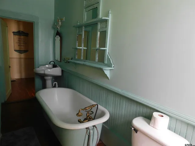 a bathroom with a sink and mirror