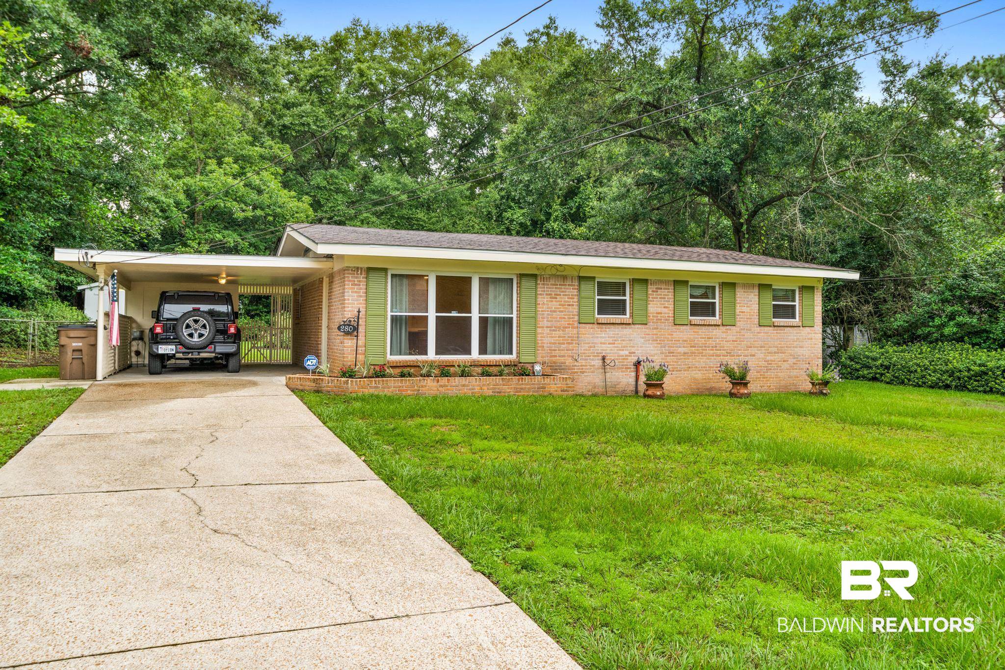280 Thrift Street Mobile, AL 36609 - Photo 1 of 22 Single story home featuring a front lawn and a carport