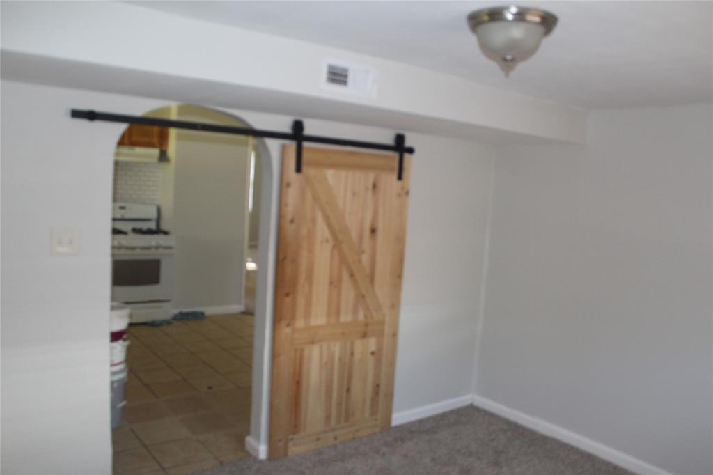 1010 Appleblossom Lane Mesquite, TX 75149 - Photo 11 of 16 a bathroom with a shower and a glass door