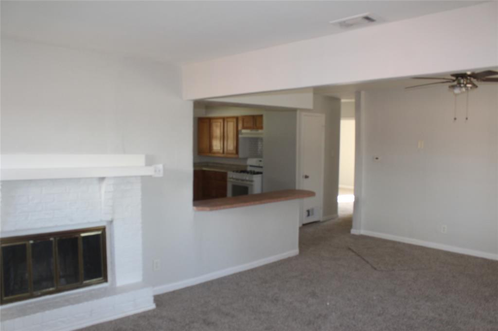 1010 Appleblossom Lane Mesquite, TX 75149 - Photo 9 of 16 a view of empty room with a fireplace
