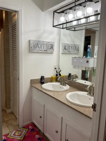 a workspace with furniture and mirror