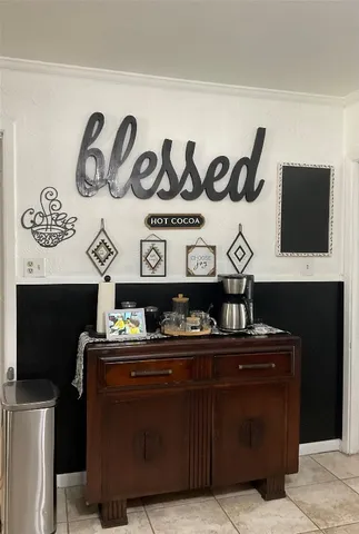 a view of a chairs and a table in a room