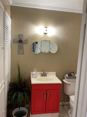 a bedroom with a bed and a cabinets