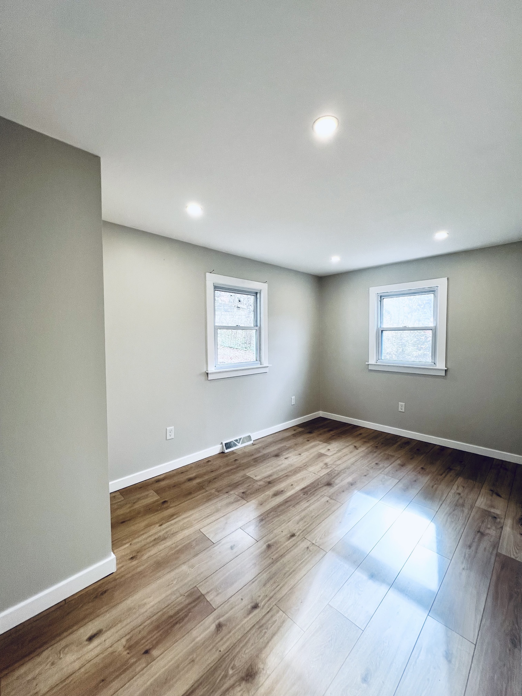 8 Rustic Road Ridgefield, CT 06877 - Photo 11 of 18 an empty room with wooden floor and windows