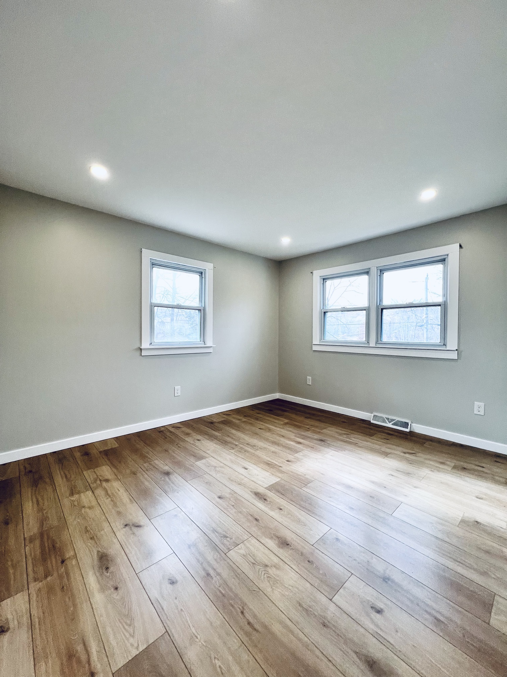 8 Rustic Road Ridgefield, CT 06877 - Photo 12 of 18 an empty room with wooden floor and windows