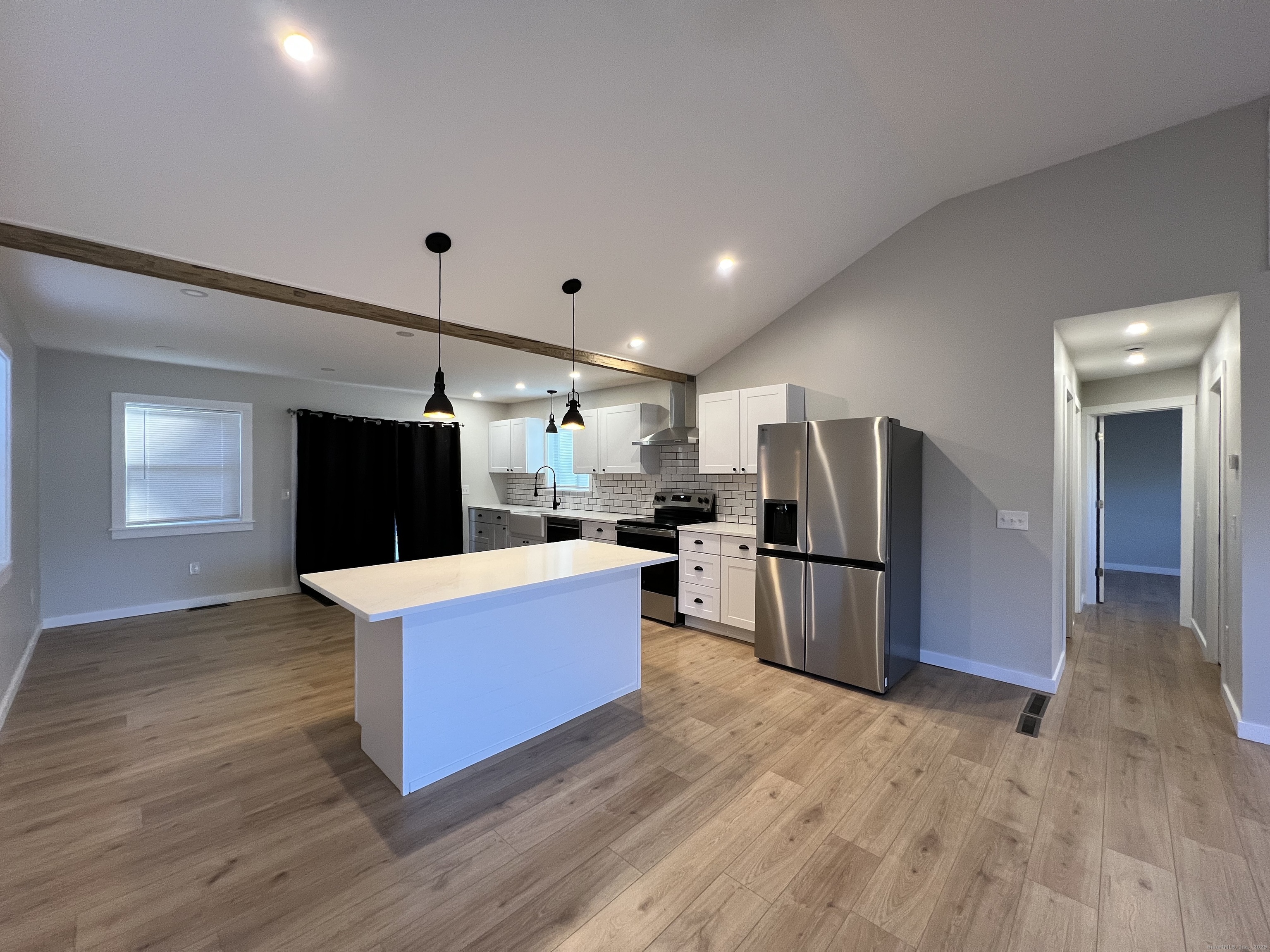 8 Rustic Road Ridgefield, CT 06877 - Photo 3 of 18 a living room with furniture and a flat screen tv