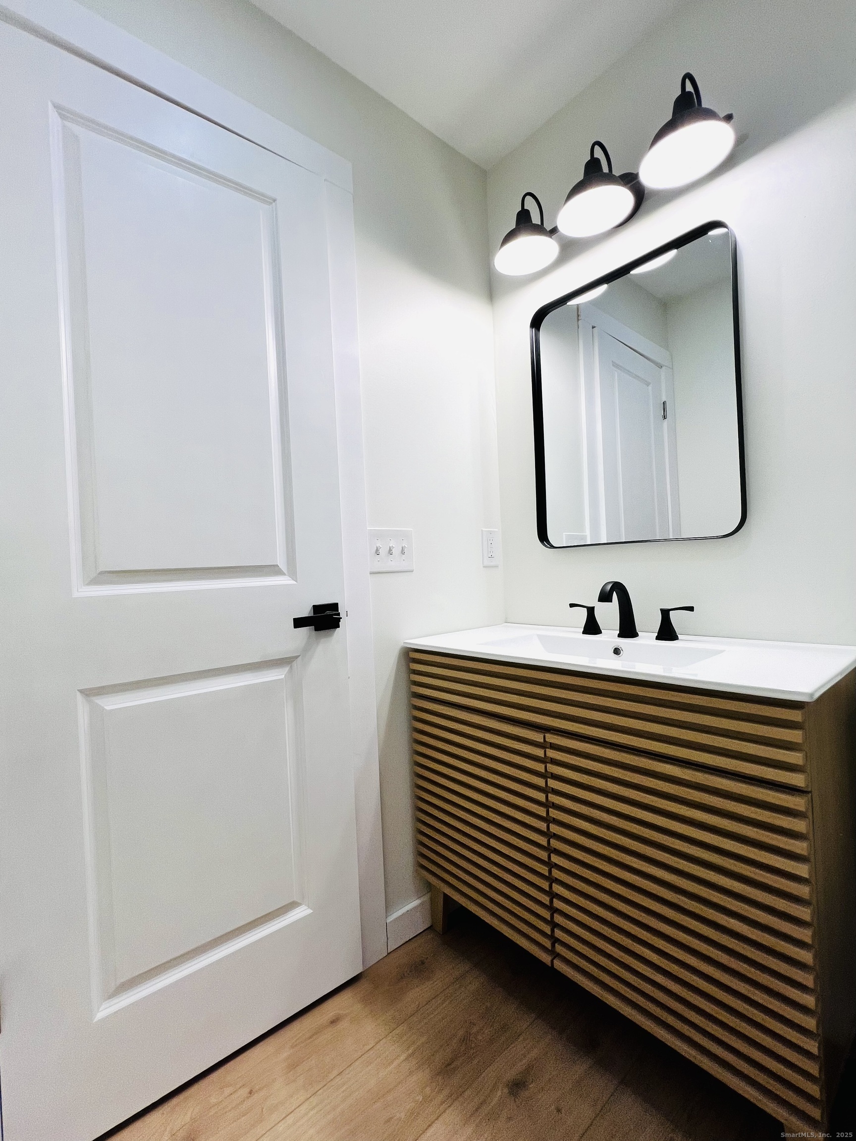8 Rustic Road Ridgefield, CT 06877 - Photo 9 of 18 a bathroom with a sink and a mirror