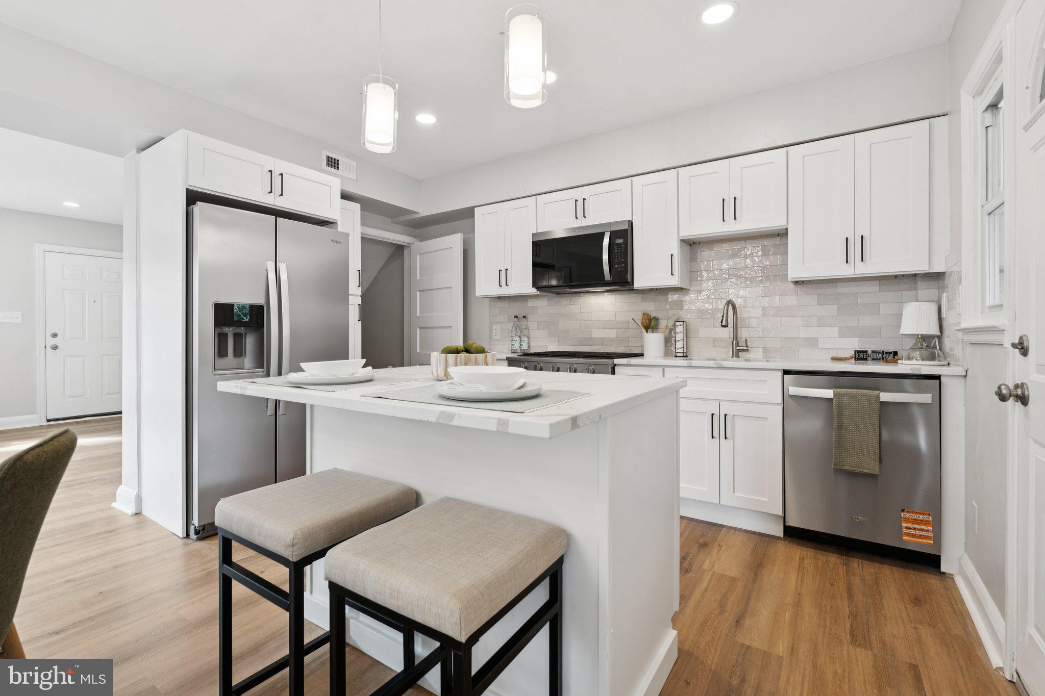 1014 Upnor Road Baltimore, MD 21212 - Photo 1 of 25 a kitchen with a sink cabinets and stainless steel appliances