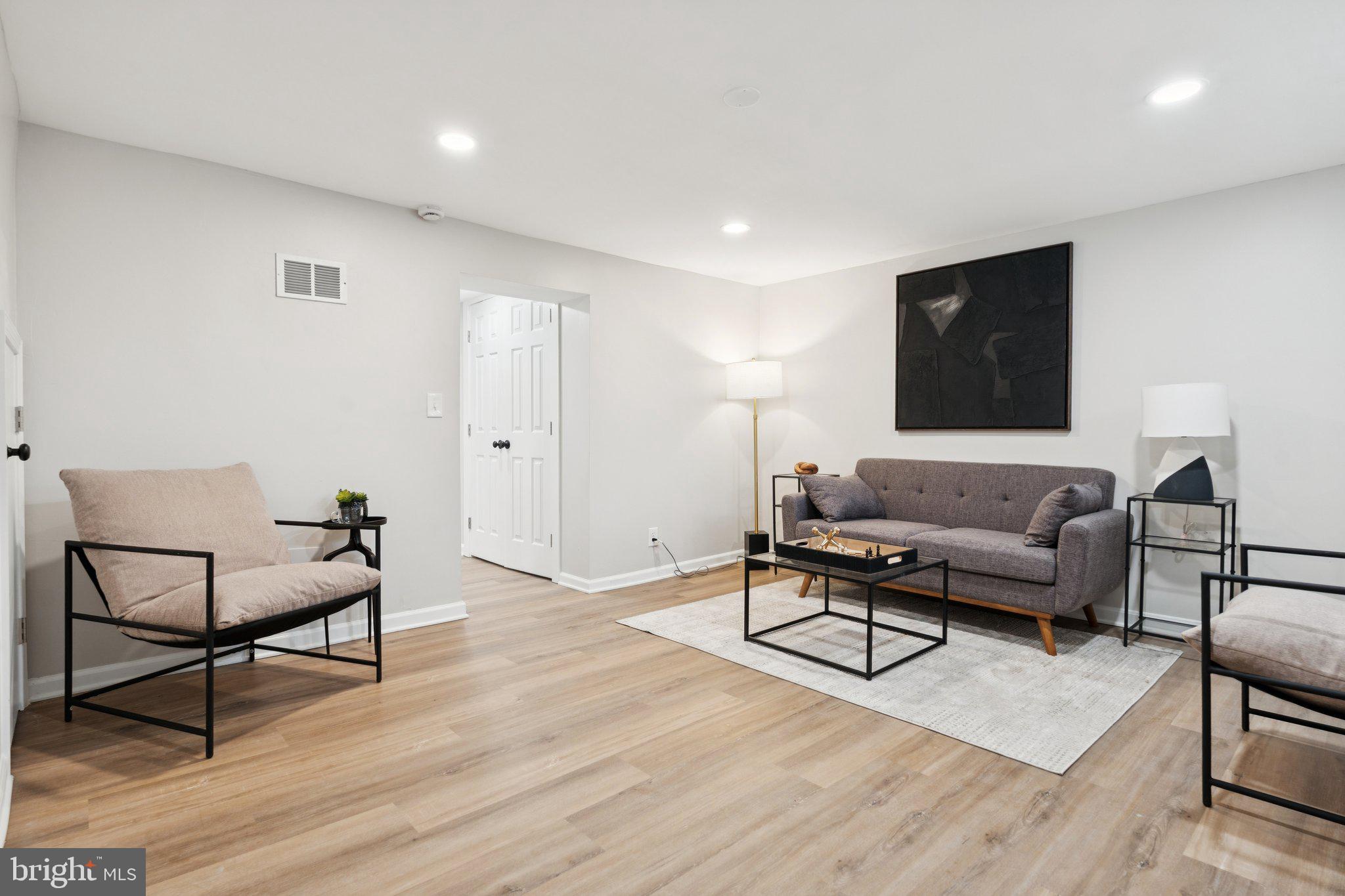 1014 Upnor Road Baltimore, MD 21212 - Photo 11 of 25 a living room with furniture and a wooden floor