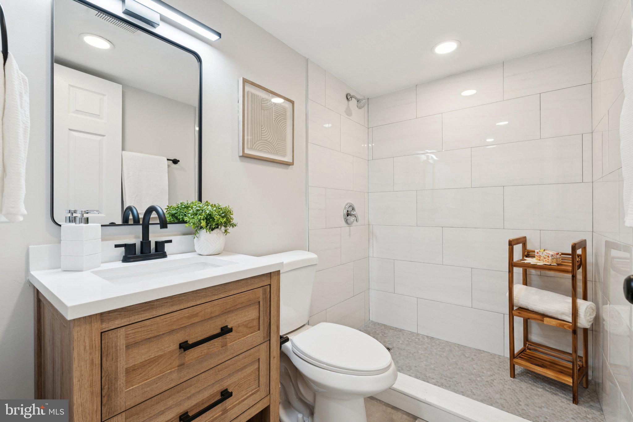 1014 Upnor Road Baltimore, MD 21212 - Photo 12 of 25 a bathroom with a sink toilet and vanity